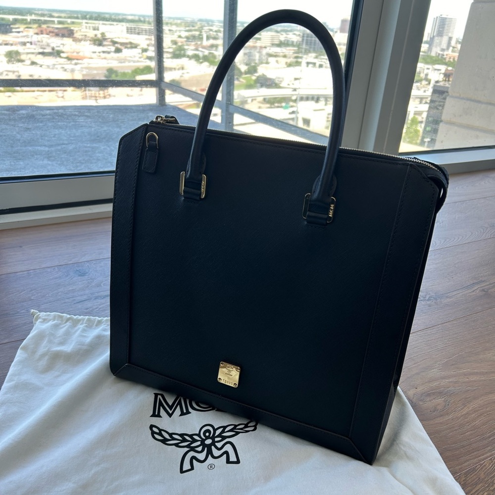 Beautiful classy Saffiano leather MCM bag. Comes with dust bag & straps